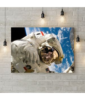 Картина на холсте Космонавт над землей, 50х35 см